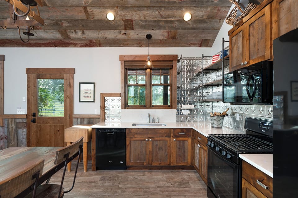 Dishwasher, microwave, stove top, oven, and fridge.