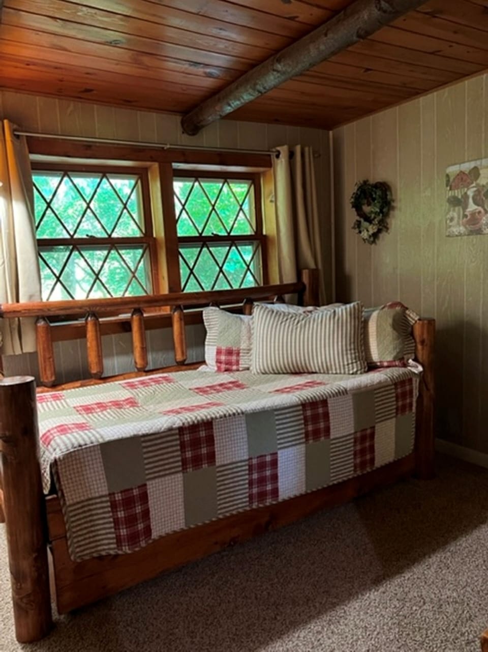Bedroom 2 full view with beam ceiling