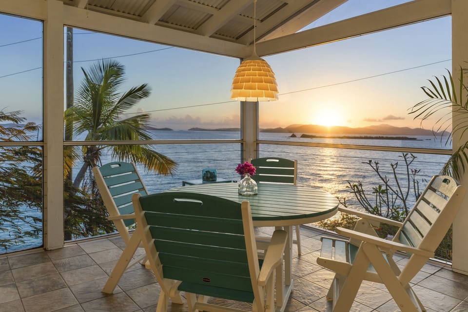 Sunsets: the large 15' x 20' screened in Veranda...with the sounds of the surf.