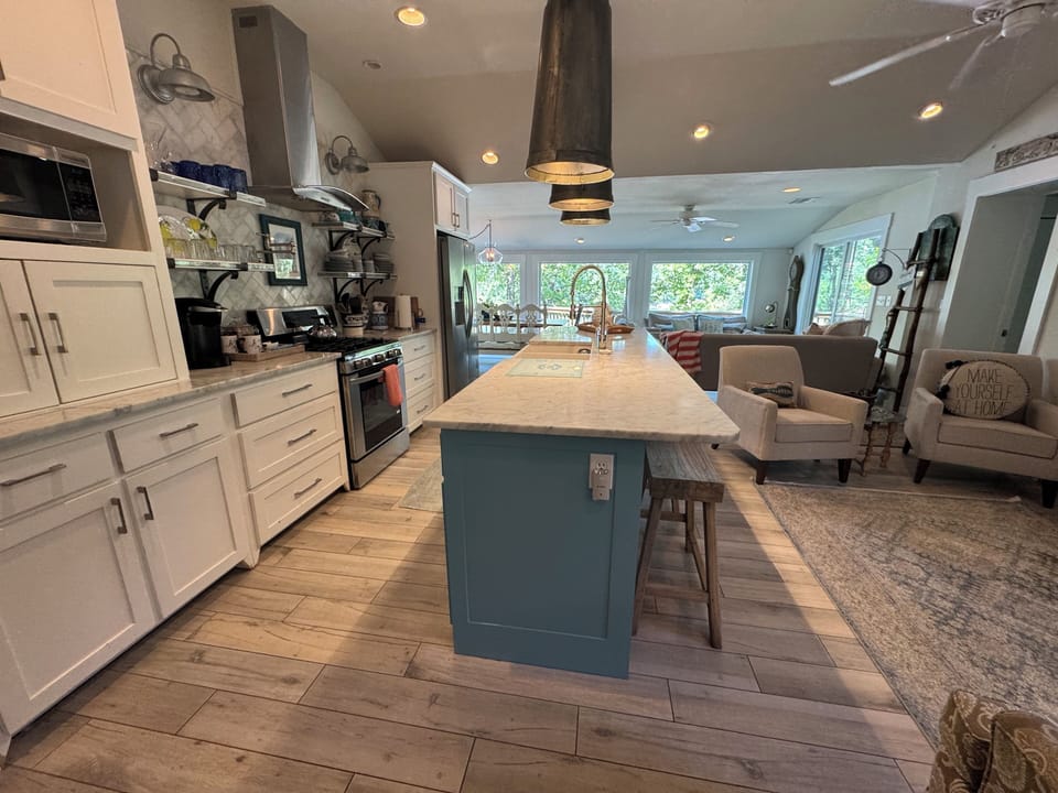 Fresh paint on cabinets and new furniture really makes it look beautiful!