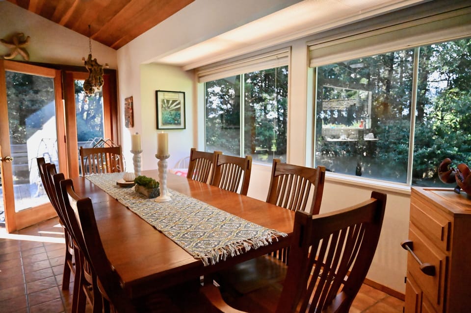 Dining room table with backyard view.