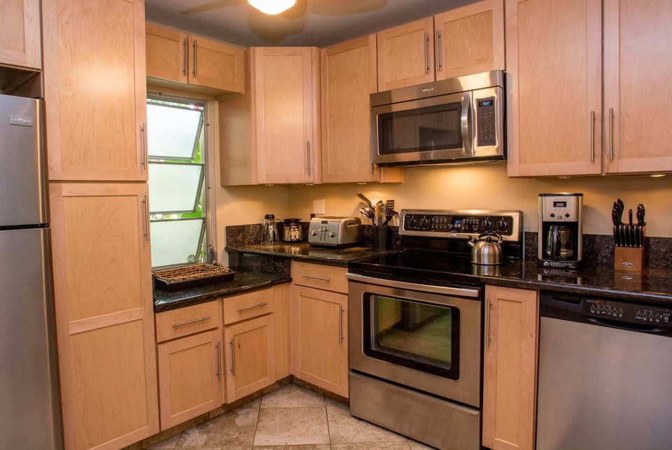 Gorgeous Kitchen with maple cabinets, stainless appliances & granite counters.
