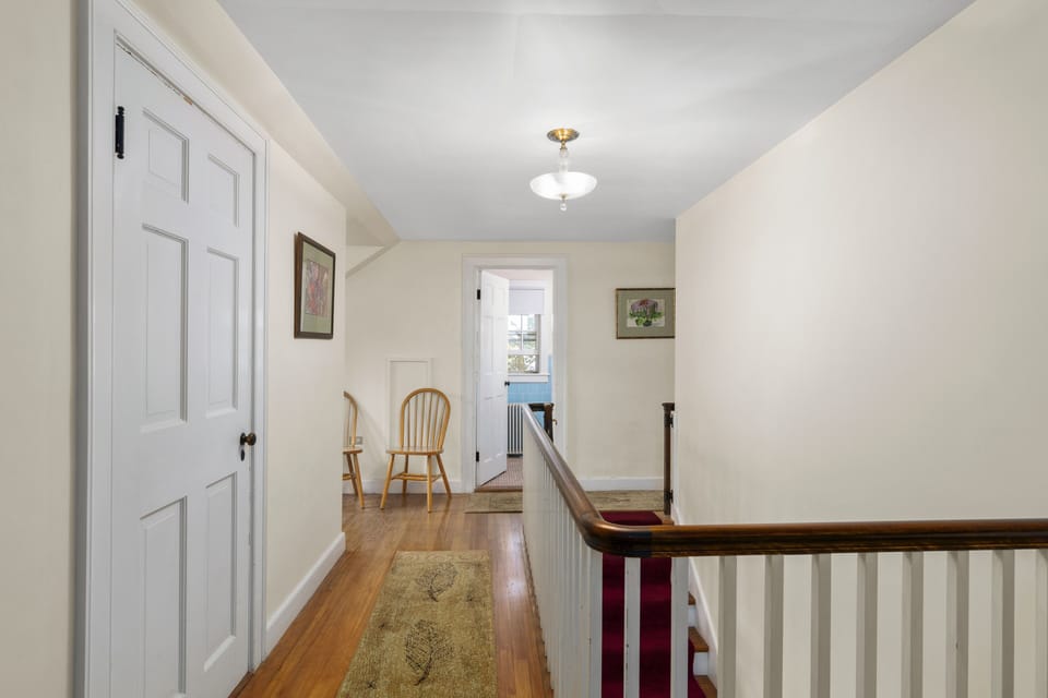 Second floor looking into shared blue bathroom.