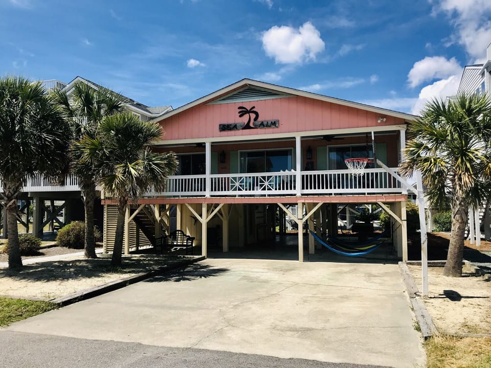A colorful cottage steps from the beach!