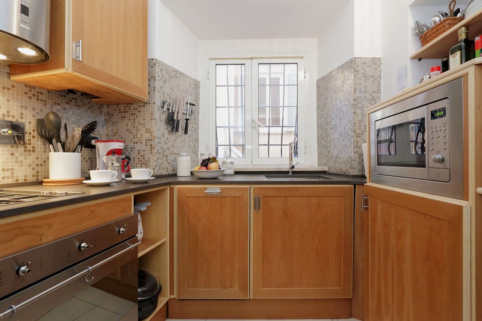 Fully equipped kitchen with microwave, coffee makers, dishwasher, washer/dryer.