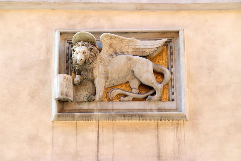 On the building across from us, where Bernini once lived. the Lion of St. Mark.