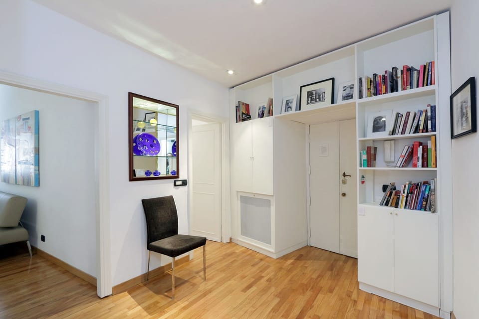 Entry foyer, including our library -- with tons of books on Rome!