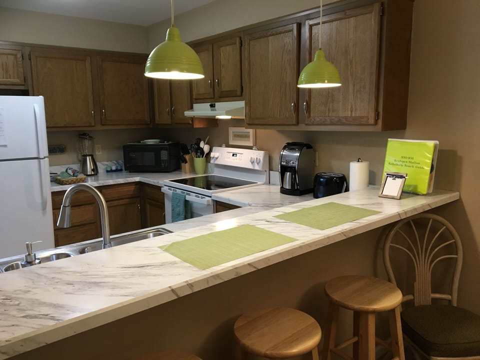 Kitchen breakfast bar with extra seating.