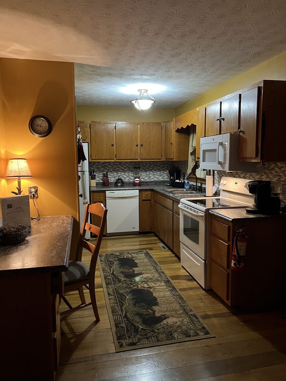 Newly added backsplash and new microwave over oven