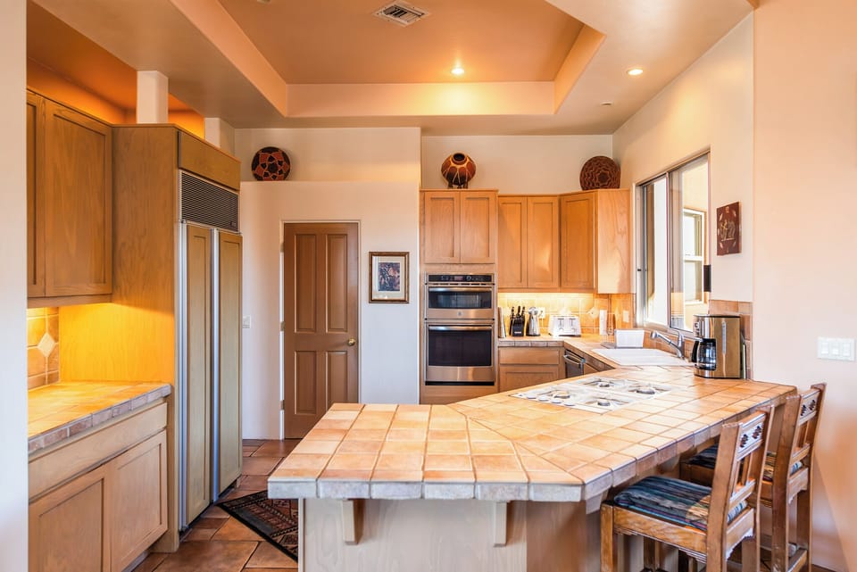 Kitchen showing island with seating for two.