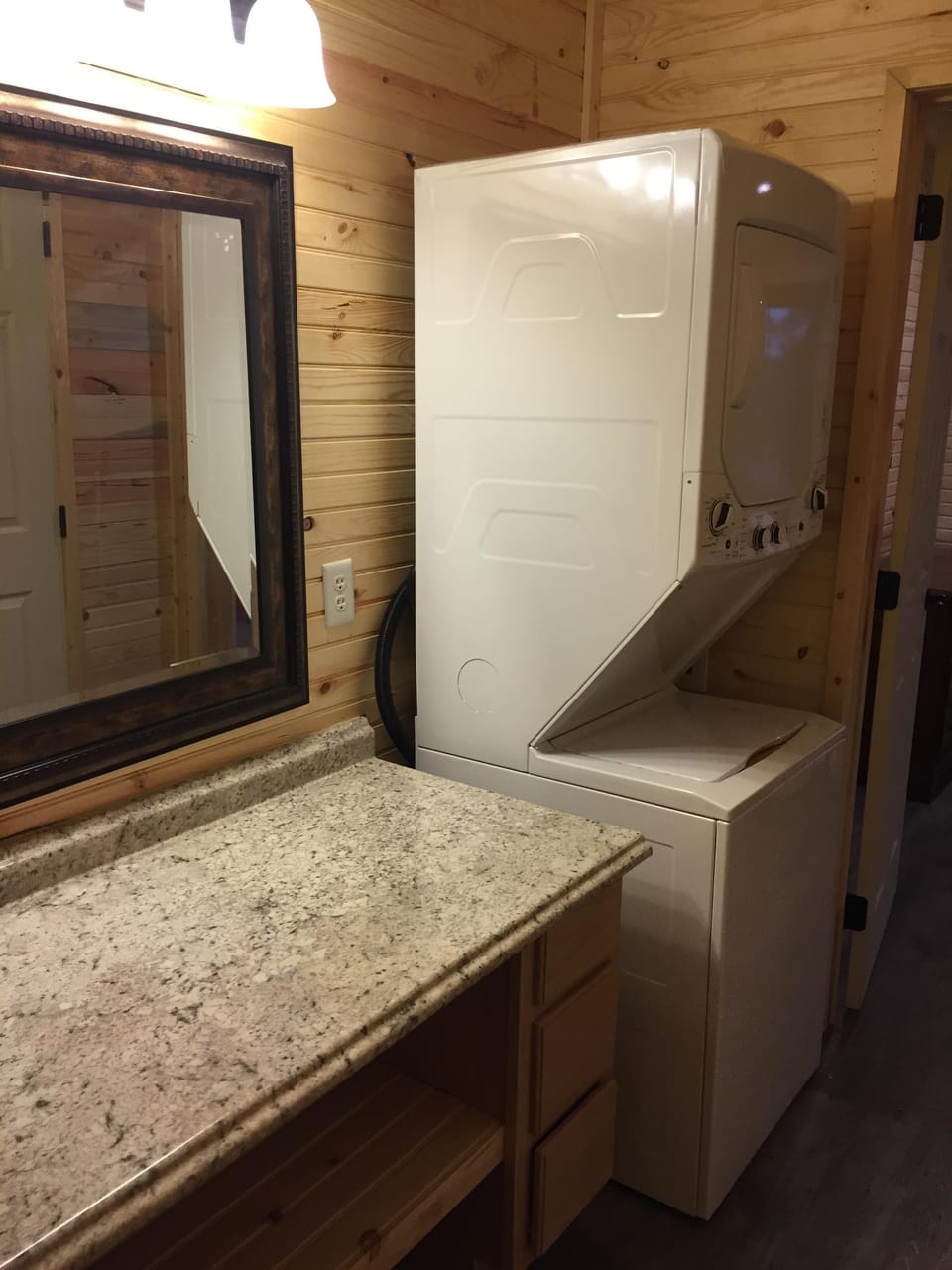 Main Level Bathroom counter and small laundry machine
