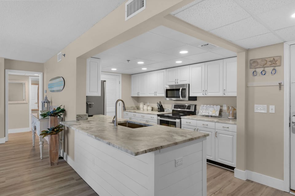 New granite counters, sink.  Fully stocked kitchen