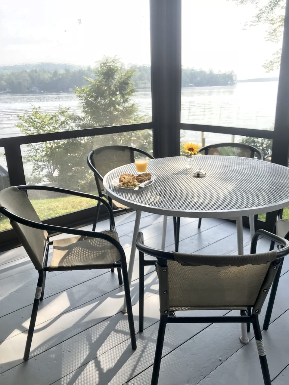 Enjoy breakfast on the porch surrounded by the lake