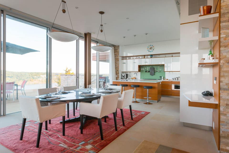 Gourmet kitchen abuts dining area seating 12.