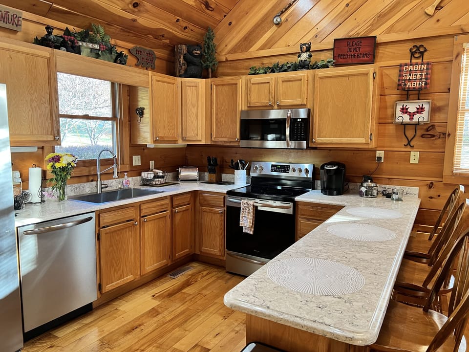 Spacious Kitchen with quartz countertops & island serving area
