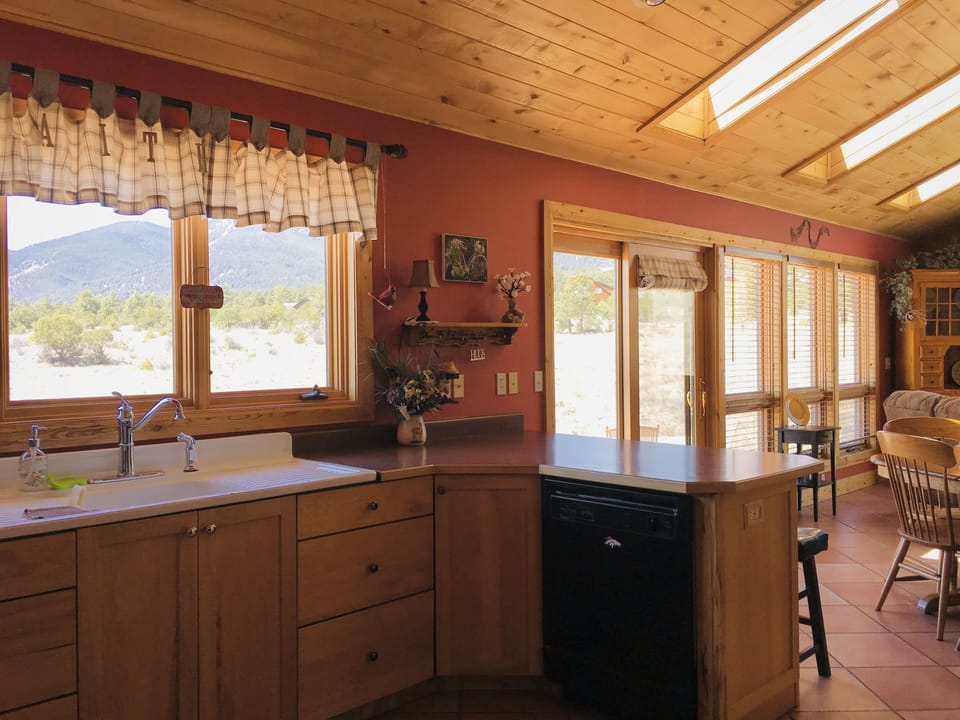 Plenty of windows to enjoy the beauty as you are in the kitchen 