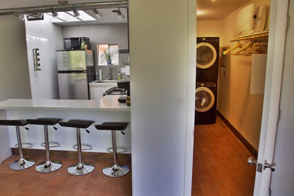 The walk-in closet include Washer & Dryer and lots of storage space for luggage