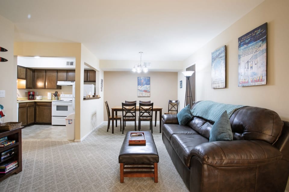 View of living room, dining room, and kitchen.