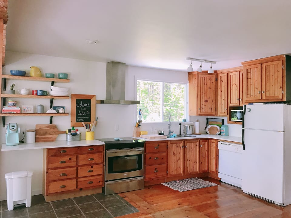 Open concept kitchen and living area with lake views.