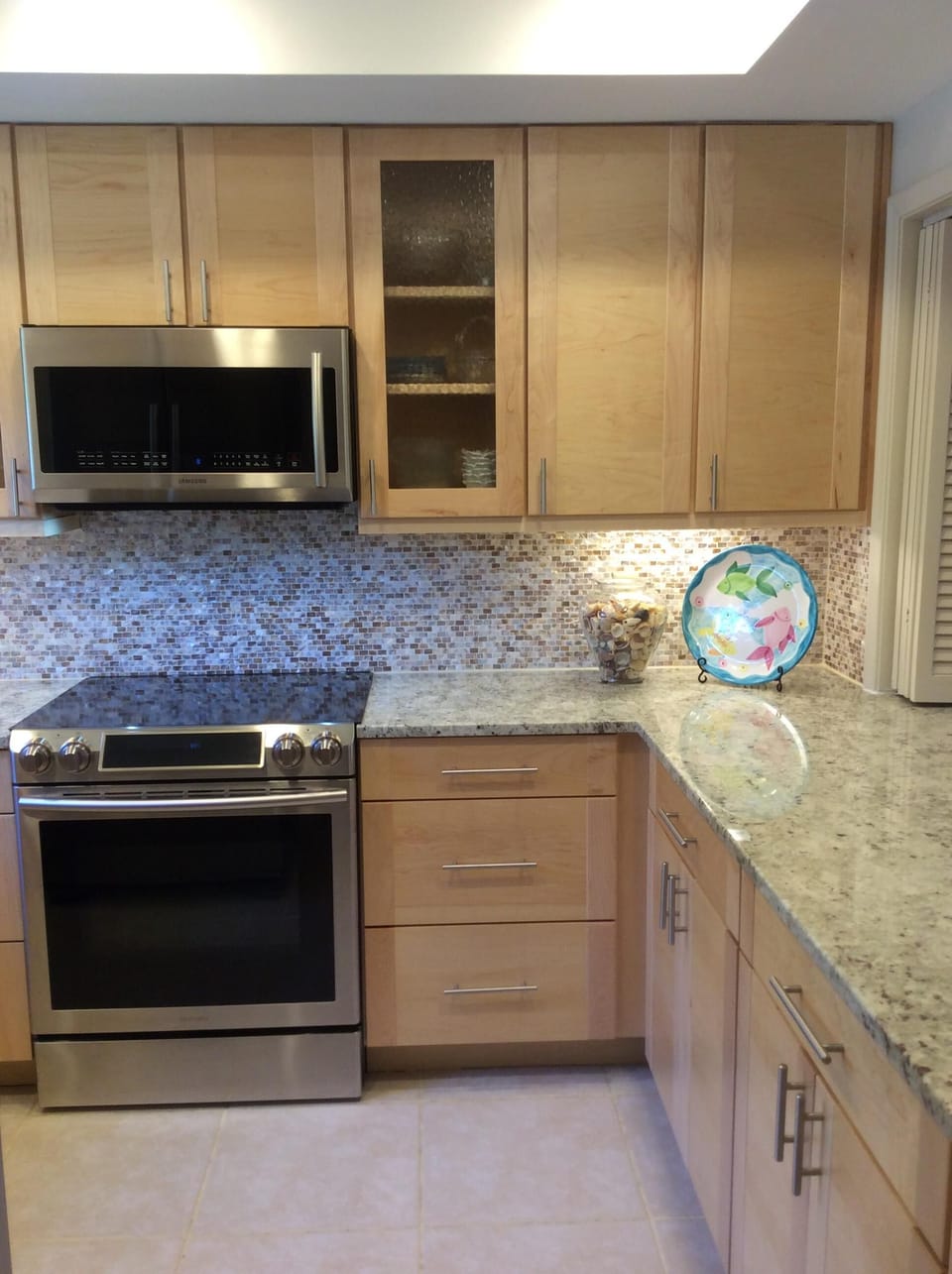 New upgraded stainless steel appliances in recently renovated kitchen