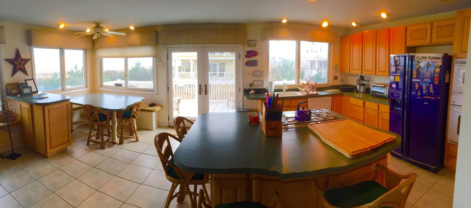 Dining and kitchen, overlooking the dunes.