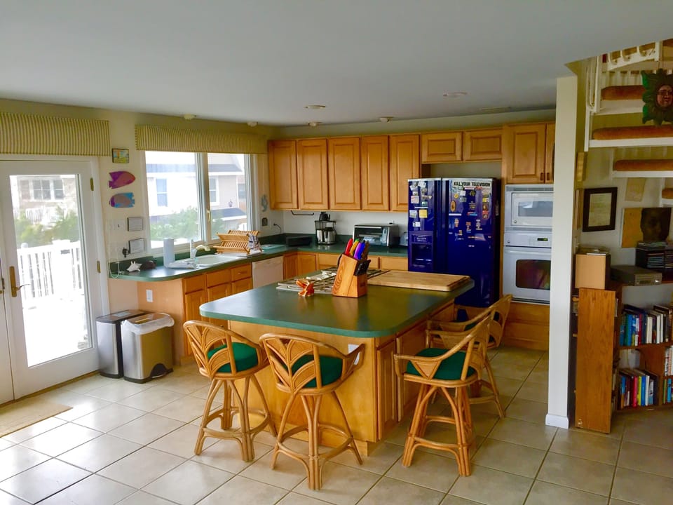 Good kitchen, well stocked, with island stove and sharp knives.