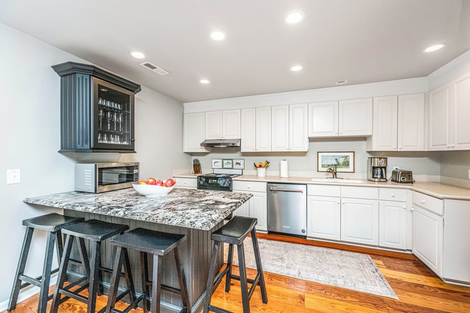 Modern kitchen is fully appointed with plenty of storage and prep space.