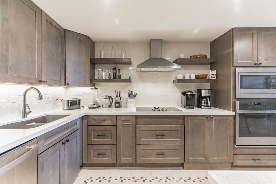 Reno'd kitchen complete with microwave, wall oven, cooktop and coffee station.