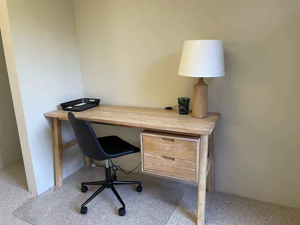 Office desk with rolling chair