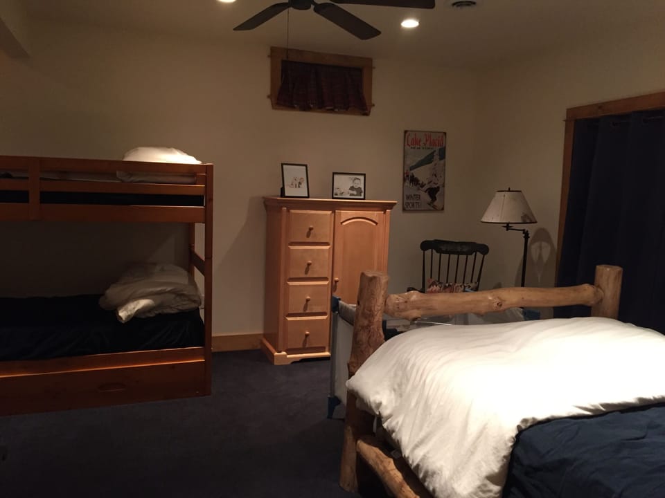 Bunk room with full bed