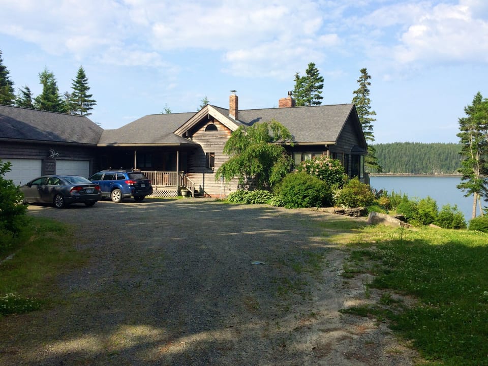 As you pull in the driveway you will be greeted with island and bay views.