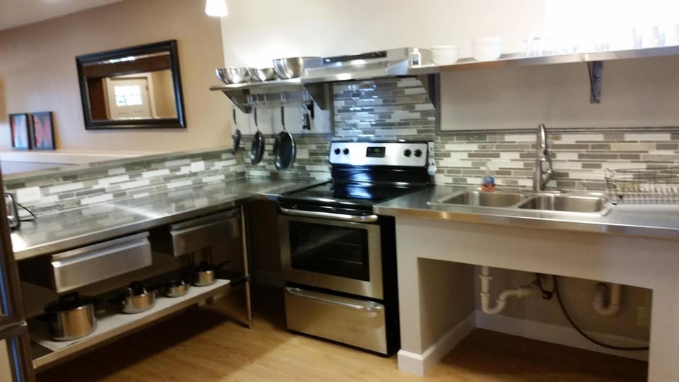 Fully equipped, spacious open kitchen with all new stainless steel appliances. 