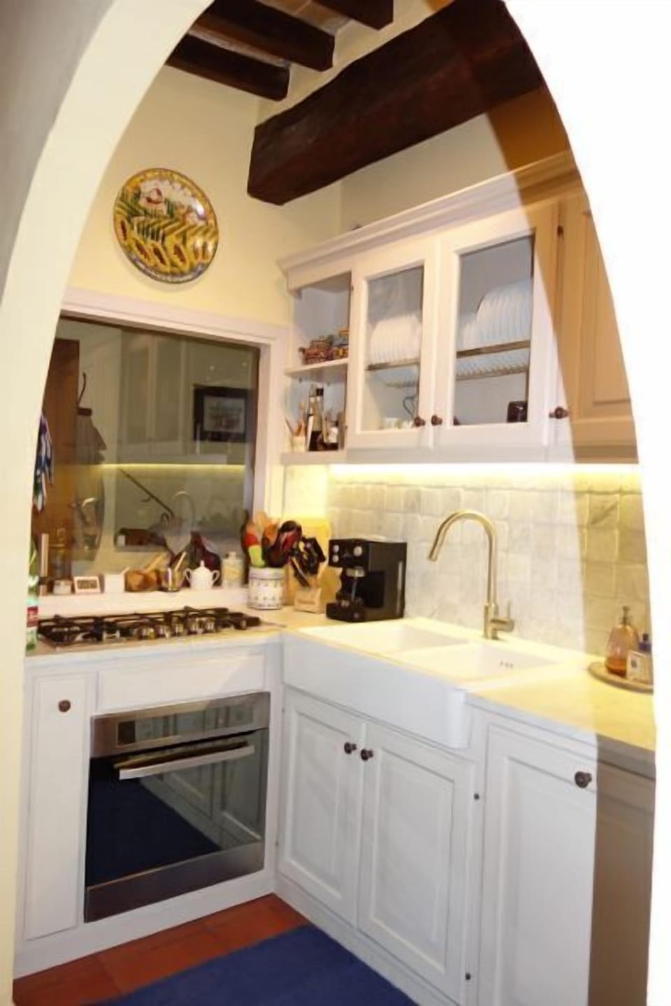Another view of the kitchen--top end cook top, oven and dishwasher.