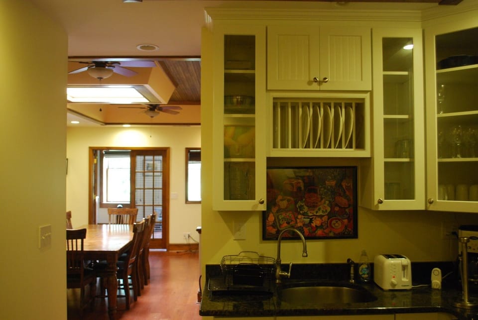 View from kitchen into dining room with skylight.