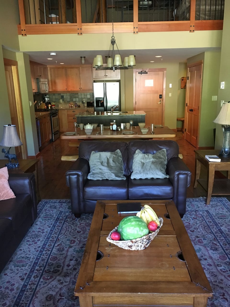 Living room with dining area and kitchen in background
