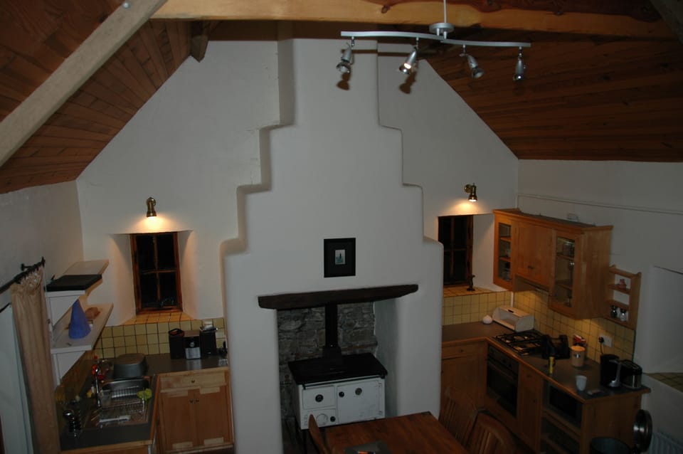 The kitchen showing the traditional 18th Century chimney