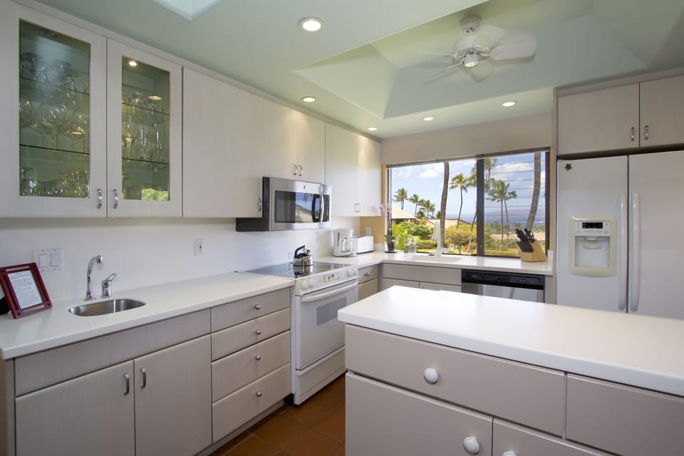 Updated kitchen with bar area great for hosting guests