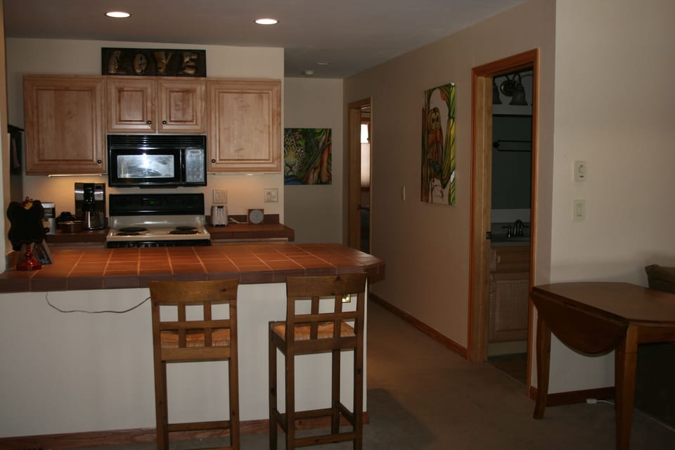 kitchen, hallway to bedrooms, door to bathroom