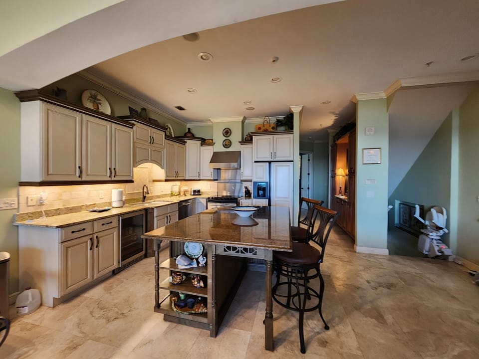 Kitchen island,  entry stairs to the right 