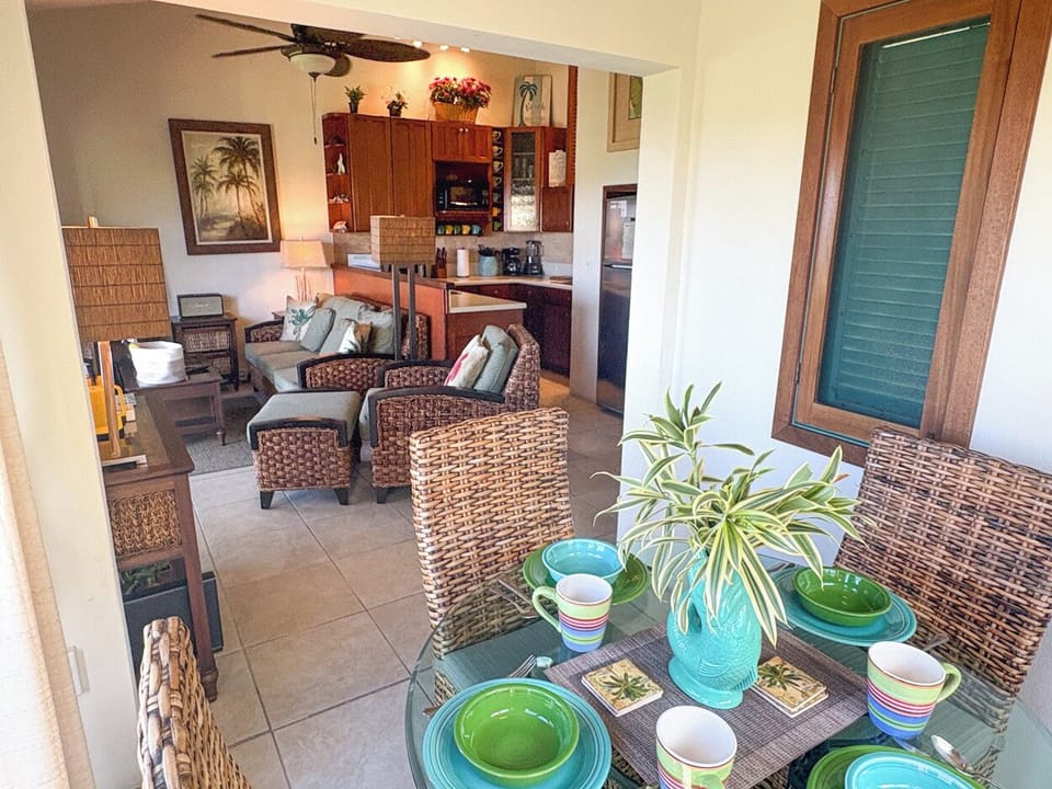 Looking from the dining area into the living room and kitchen