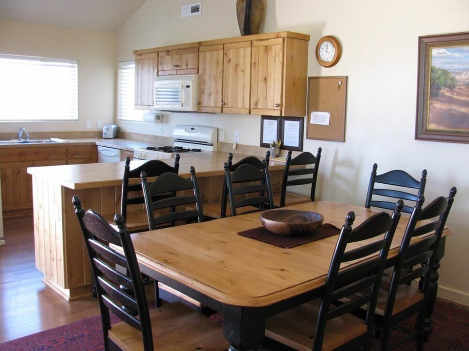 Dining room seats 6 + 3 and opens to high-ceilinged kitchen with plenty of space