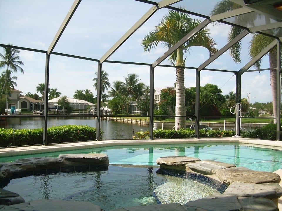 Large, enclosed pool and spa with waterview