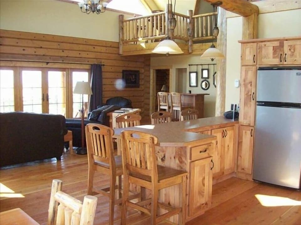Breakfast Bar & Great Room. French Doors open to deck on West side. (Sunsets)