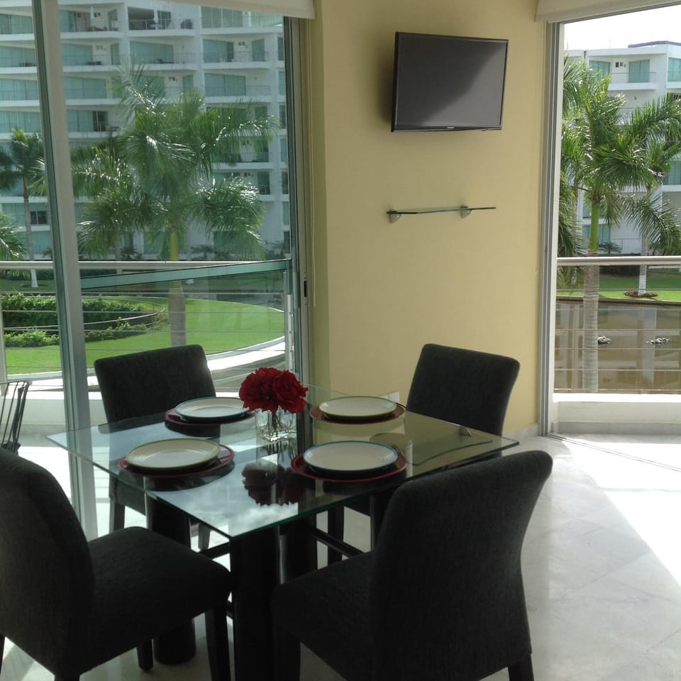Dining area with TV on the back wall
