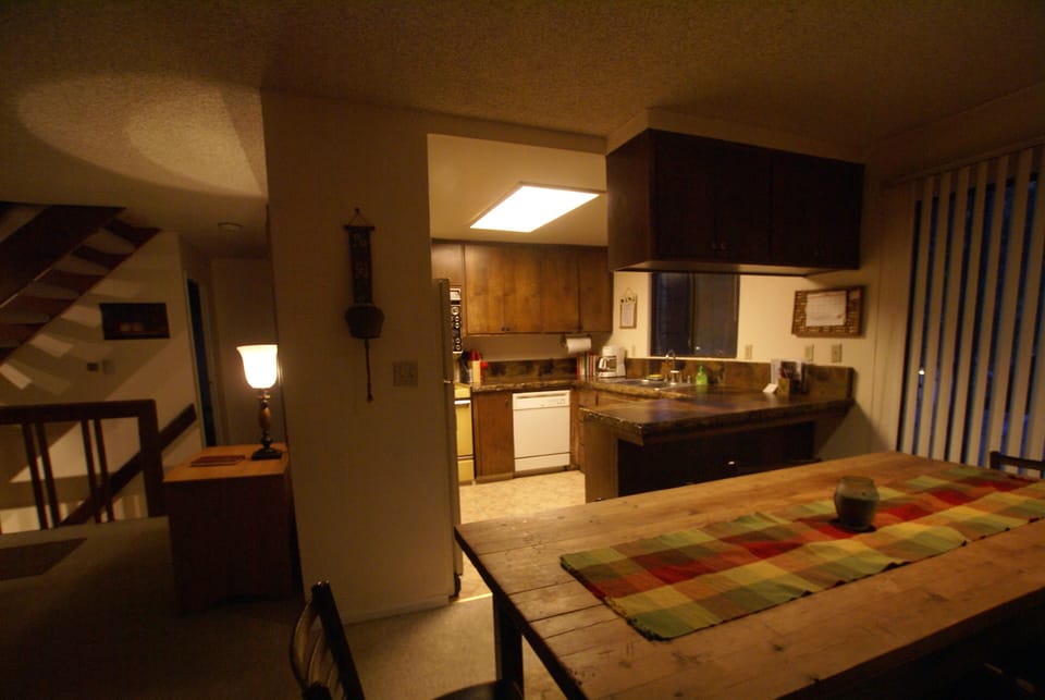 Main or middle level contains living, dining, kitchen, 2 bedrooms and 1 bathroom