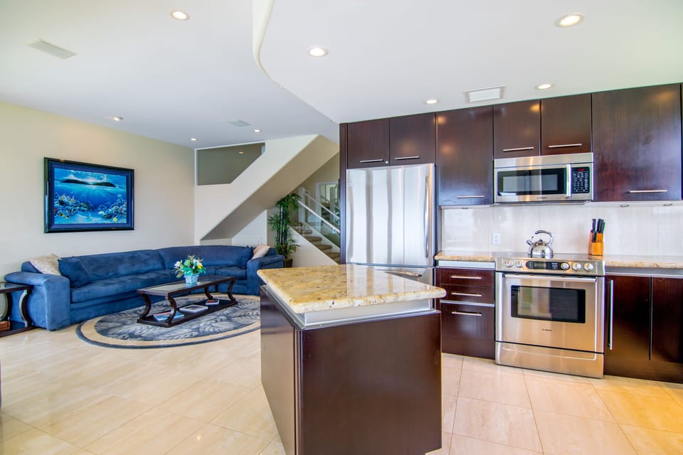 Slab granite, marble floors and ocean-inspired interior decor adorn this villa