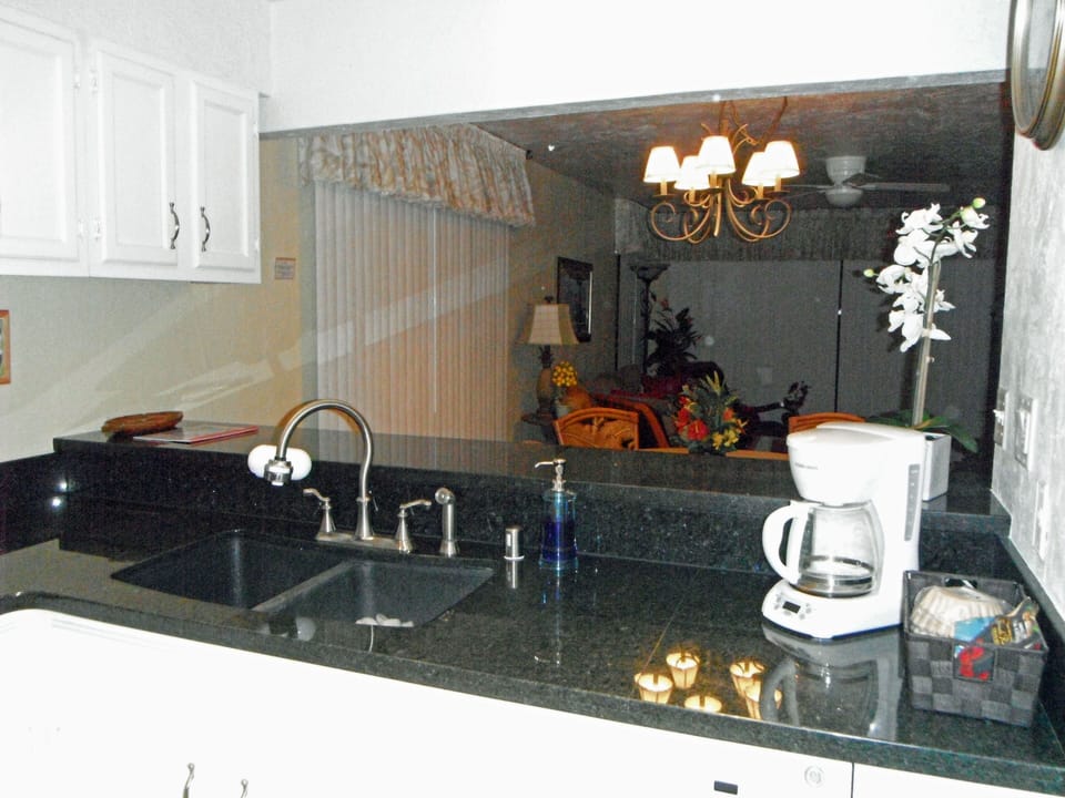 Enjoy a view of the ocean from the kitchen sink.