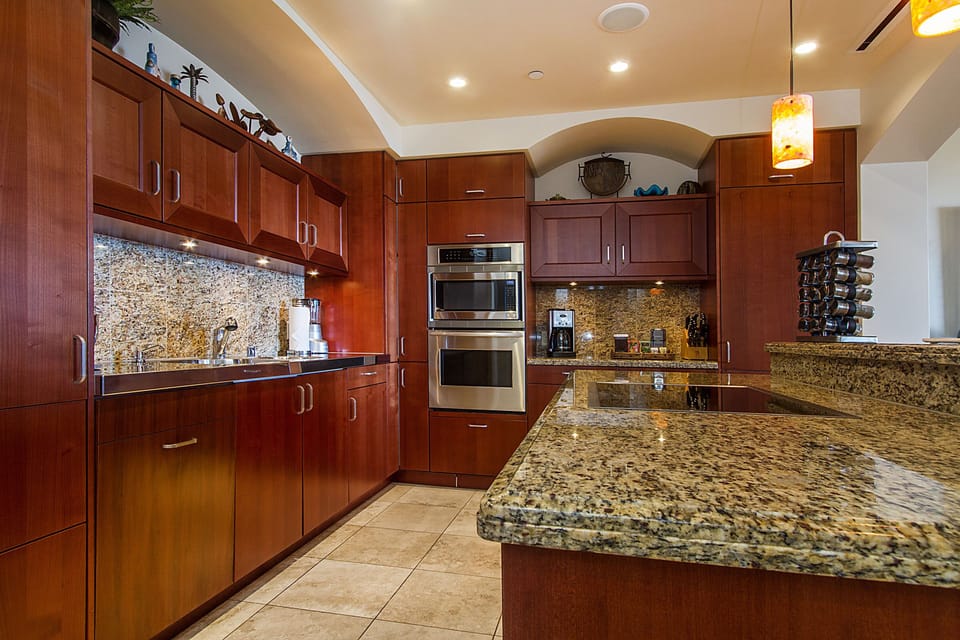 Kitchen with two Sub Zero refrigerators, microwave, Viking stove, & dishwasher