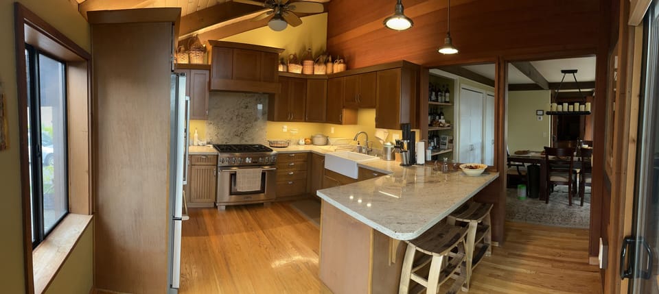 Large kitchen with island for preparing meals, access to front deck, Weber grill