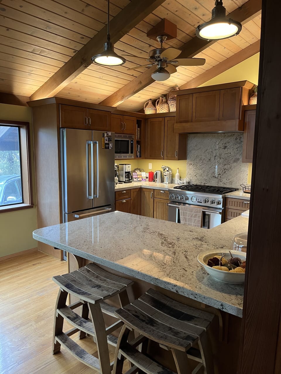 View of kitchen from dining room, custom wine stave counter stools 